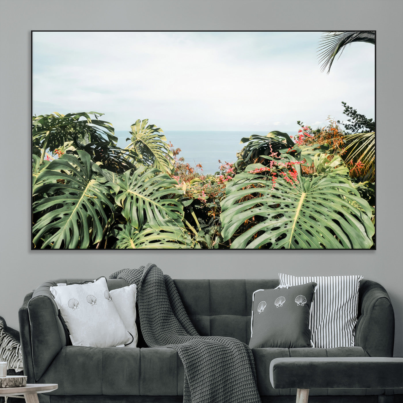 Monstera leaves and tropical flowers framing a calm ocean view, ideal for tropical coastal or exotic jungle-style interior wall decor.
