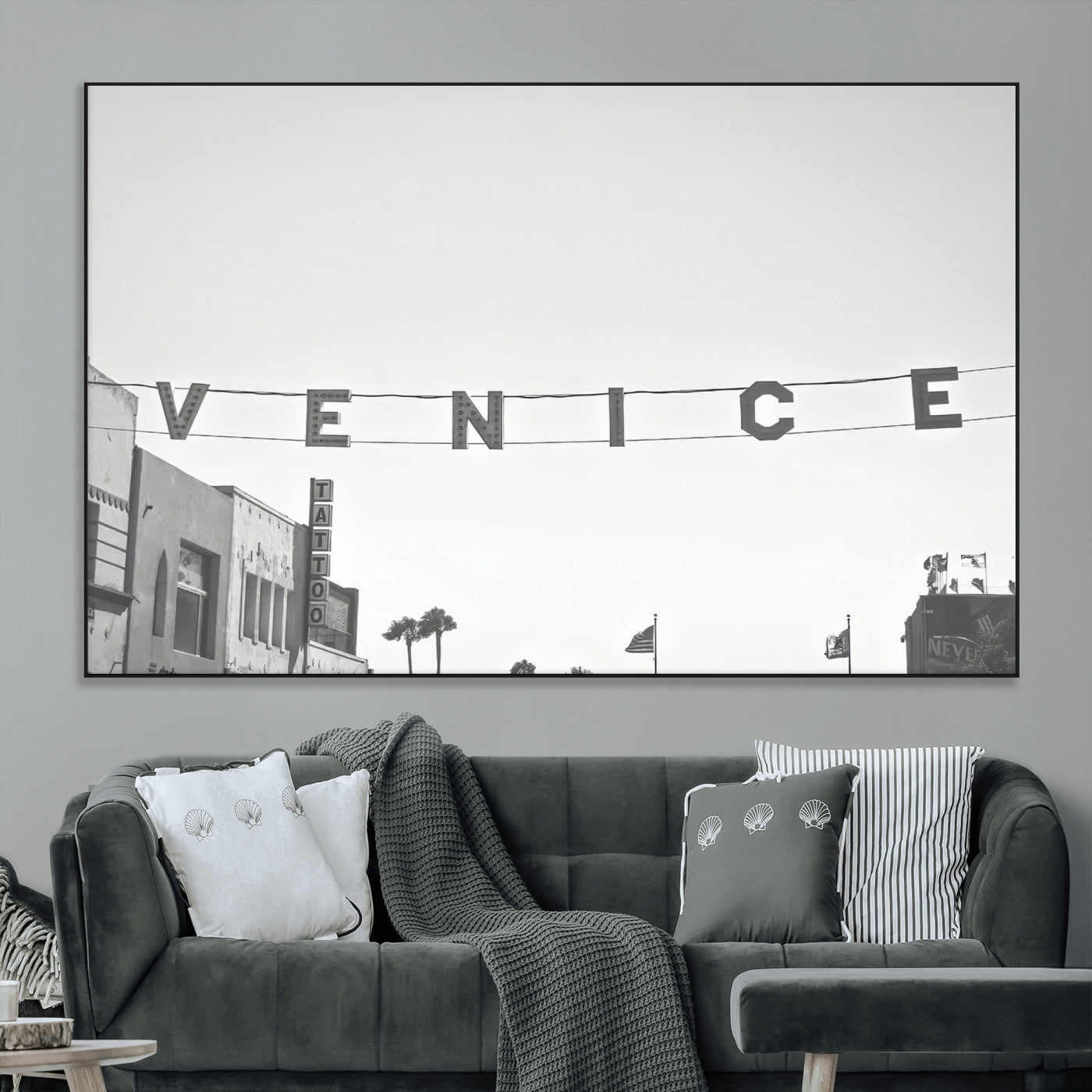 Black and white photo of Venice Beach sign and palm-lined street, perfect for urban coastal or minimalist LA-inspired wall decoration.