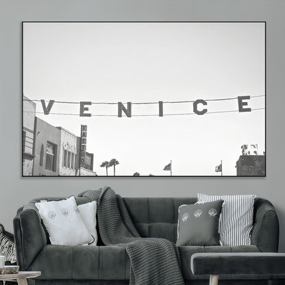Black and white photo of Venice Beach sign and palm-lined street, perfect for urban coastal or minimalist LA-inspired wall decoration.
