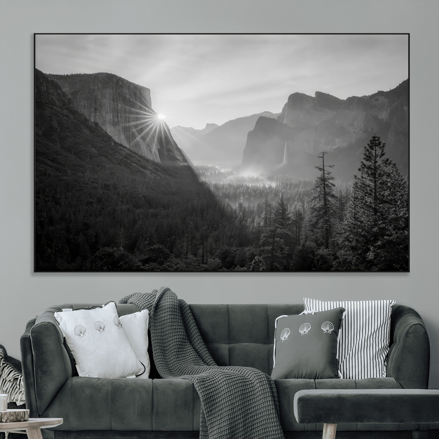 Black and white landscape of Yosemite with sun rays peeking over El Capitan, ideal for moody nature or modern rustic decor.