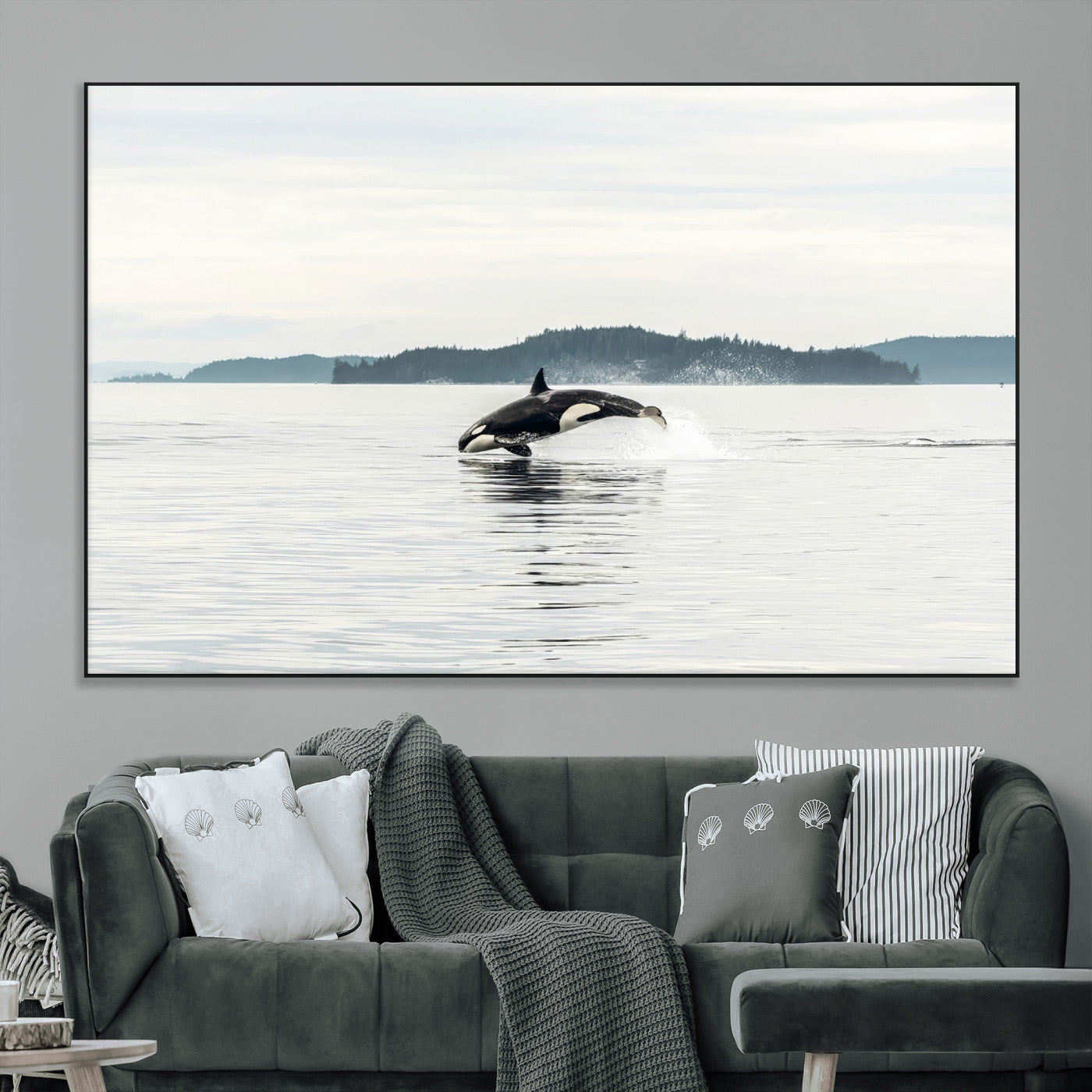 An orca jumping out of calm ocean waters with a misty island in the background, creating a serene and minimalist marine wildlife scene.