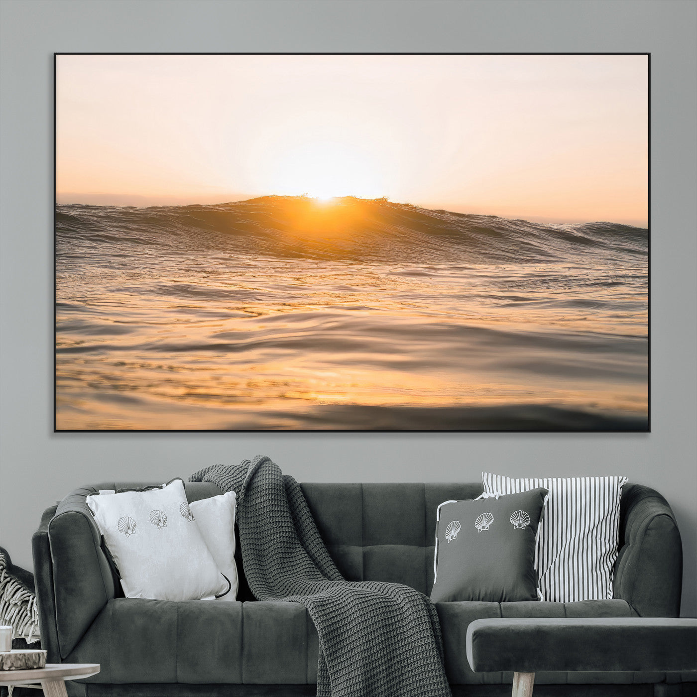 Ocean waves glowing under a warm golden sunset, reflecting soft light and calm movement, perfect for warm minimalist coastal interiors.