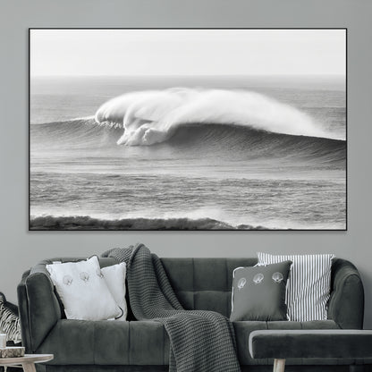 A dramatic black and white ocean wave crashing with immense force, capturing the raw power and movement of the sea in a bold seascape.