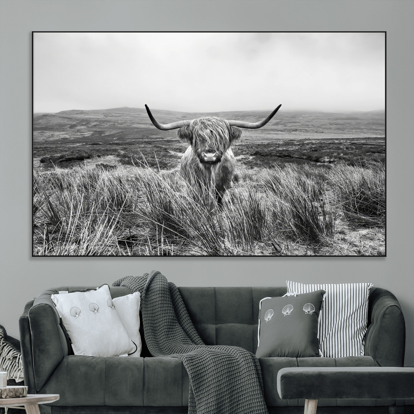 A black and white portrait of a Highland cow in a foggy Scottish countryside, capturing a rustic aesthetic and tranquil farm escape.