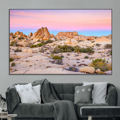 A breathtaking desert landscape featuring rugged rock formations under a vibrant pastel sunset sky, capturing the warmth and serenity of a Southwestern wilderness.