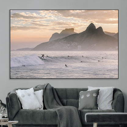 A surfer rides a golden hour wave near misty coastal mountains, surrounded by fellow surfers, capturing the spirit of a coastal adventure.
