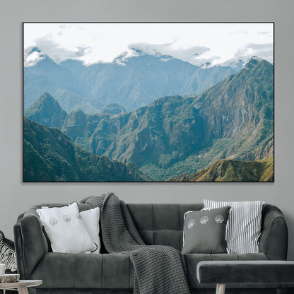 A misty mountain landscape with cloud-covered Andean peaks and lush green valleys, creating a dramatic and serene view, perfect for rustic or nature-inspired home decor.