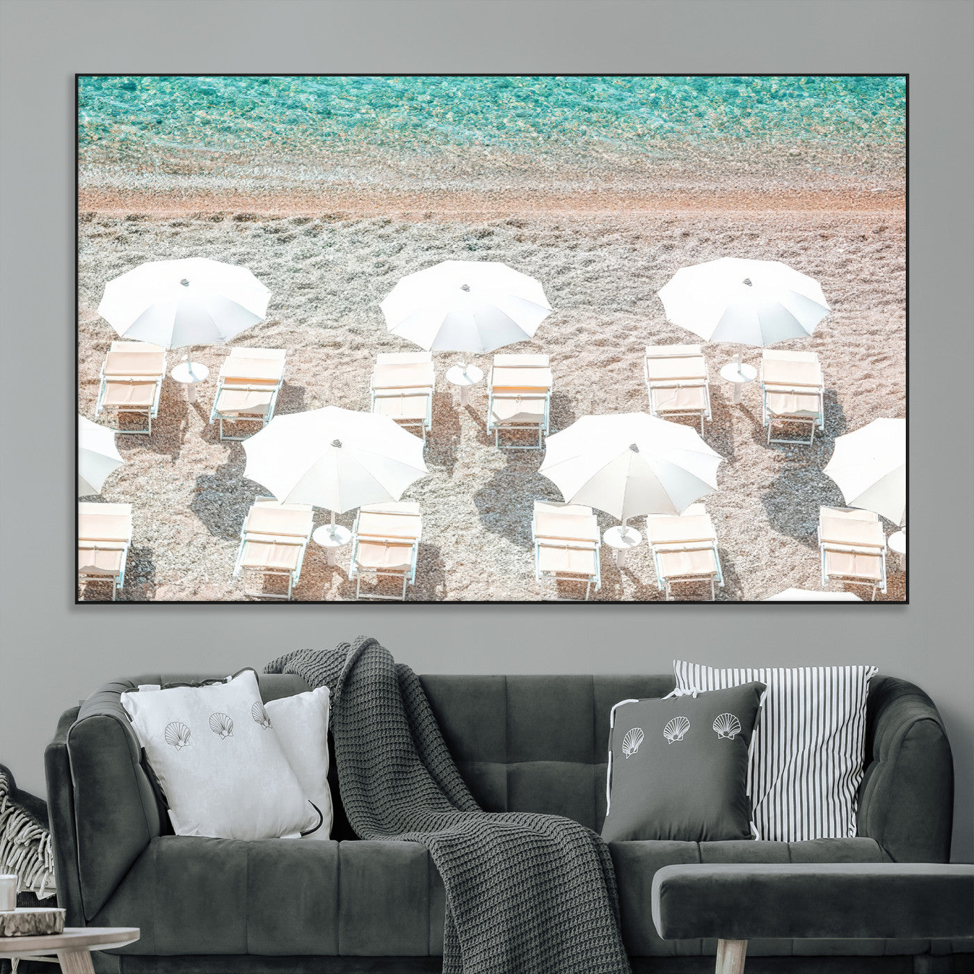 A bright beach scene with white umbrellas, pastel sand, and turquoise waters, creating a tranquil coastal vibe, perfect for beach house or summer decor.