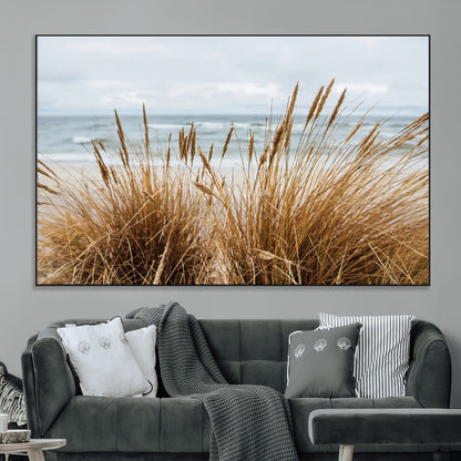 Canvas of golden beach grass swaying by the ocean under a soft cloudy sky, perfect for neutral-toned or coastal minimalist decor.