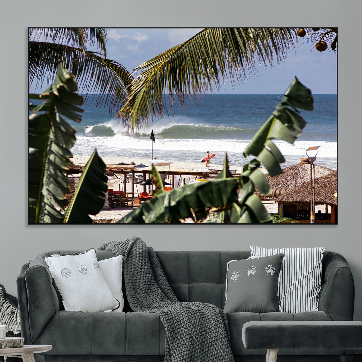 Canvas wall art of a tropical surf scene framed by palm trees, with a surfer on the shore and waves rolling in, ideal for beach-themed decor.