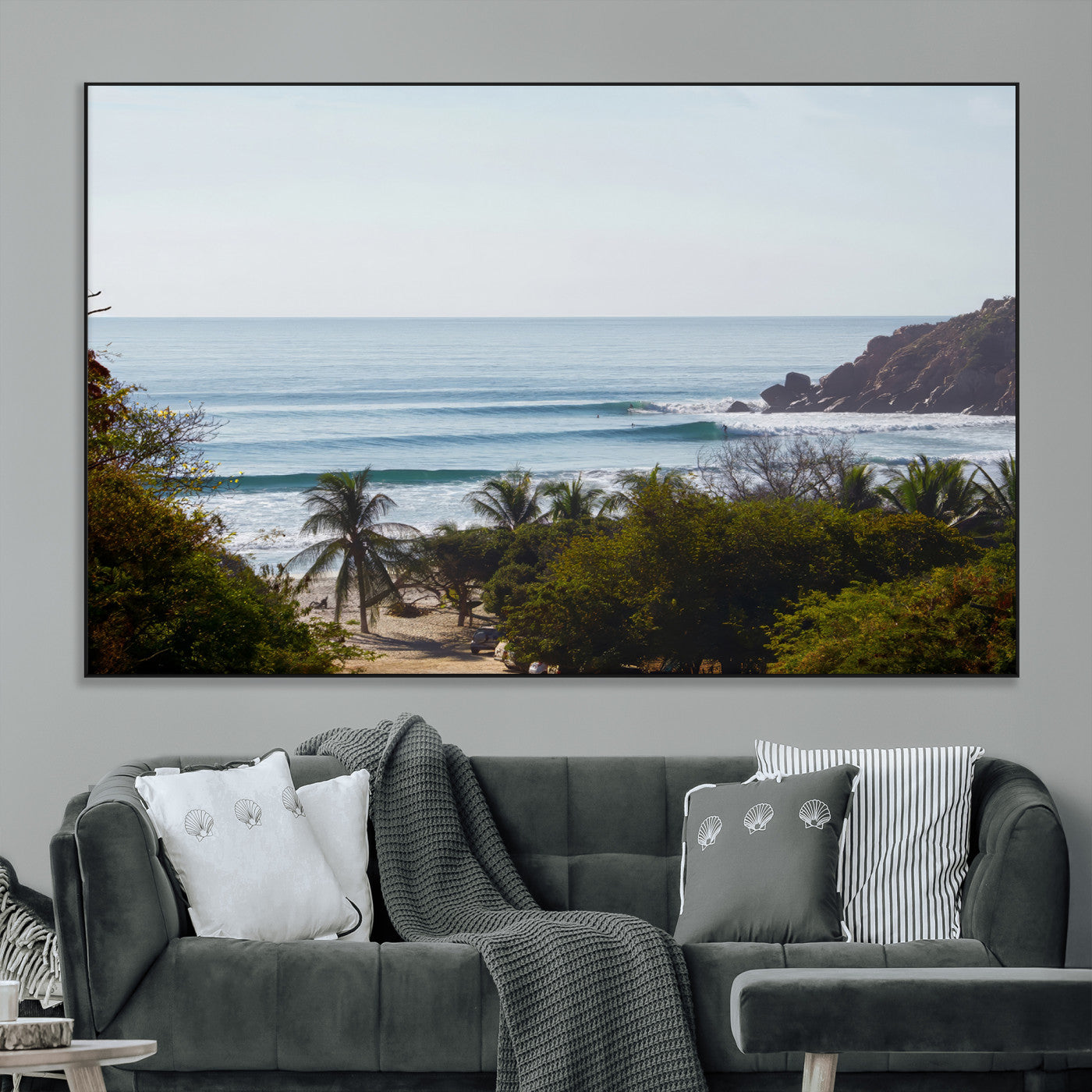 View of calm ocean waves with palm trees and a tropical coastline, ideal for coastal boho or beach-themed wall decor.