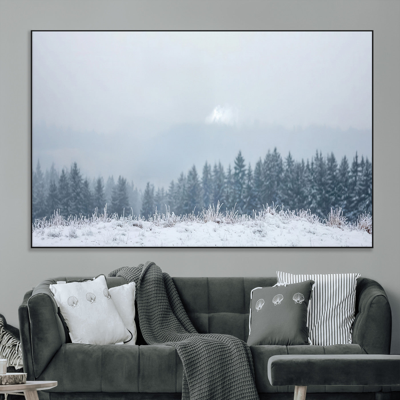 Snow-covered forest under misty sky, soft light breaking through clouds, ideal for minimalist or Nordic-inspired home decor.