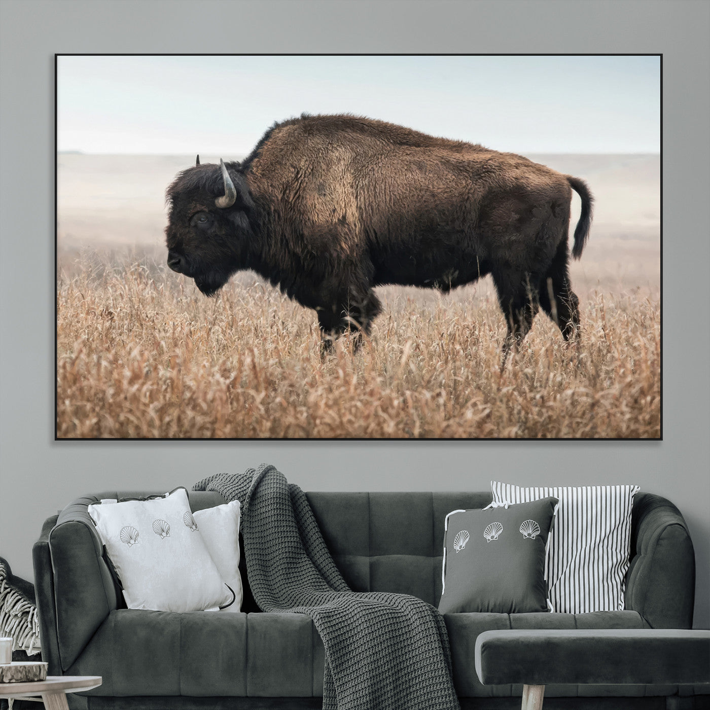 A lone bison stands in a vast prairie under a soft sky, evoking freedom and rustic charm for western or farmhouse inspired interiors.