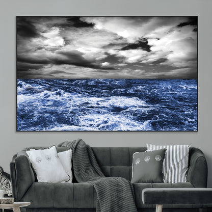 Moody canvas wall art of a stormy ocean under a dramatic black-and-white sky, perfect for bold or coastal-style interiors.