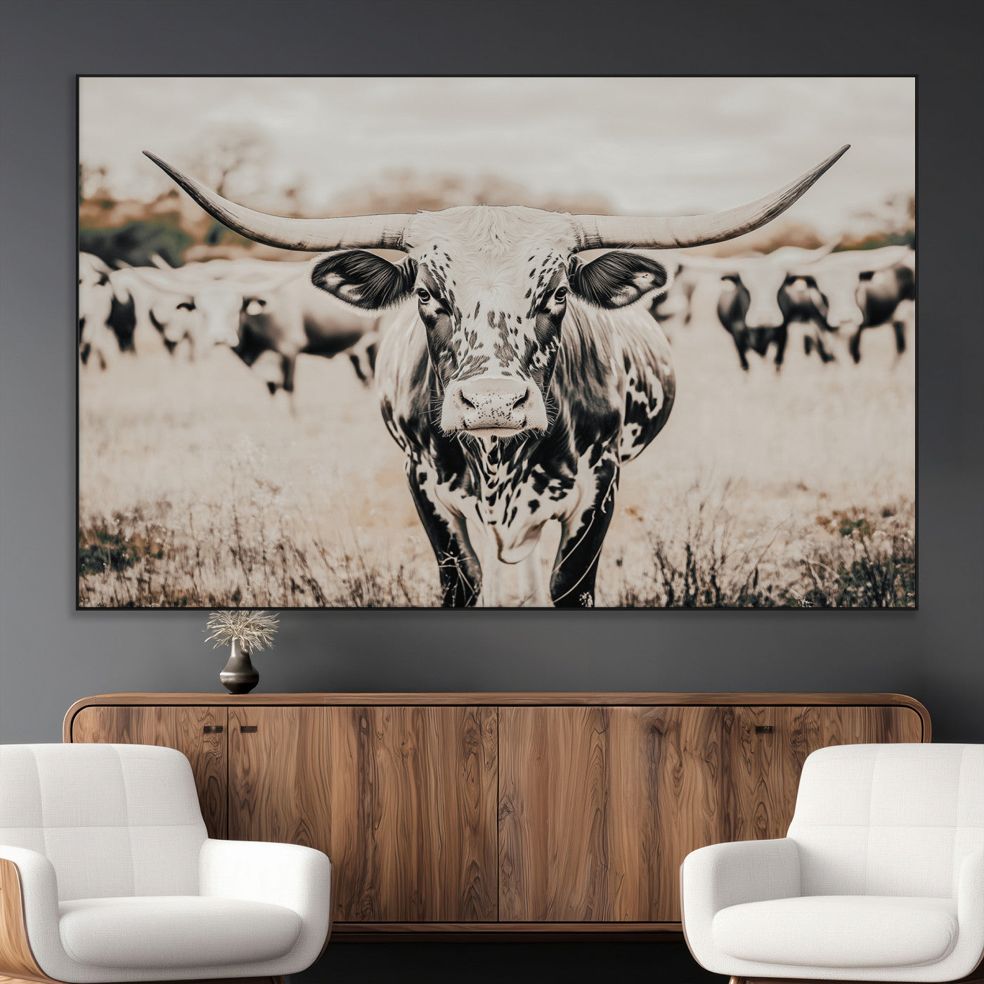 Canvas of a speckled Texas longhorn standing boldly in a field with a herd behind, perfect for rustic western or farmhouse wall decor.