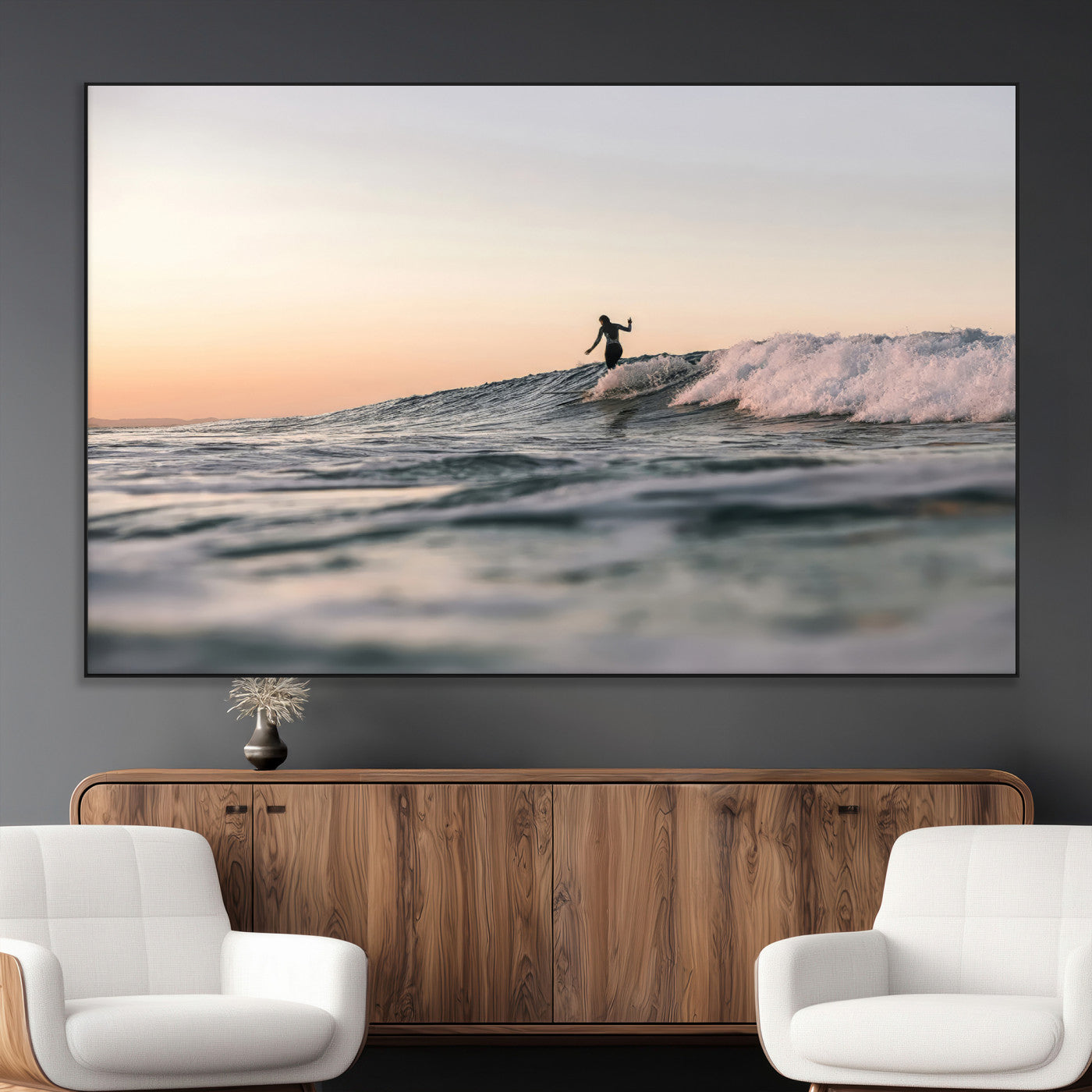 Framed canvas of a female surfer balancing on a wave at sunset, perfect for serene surf or ocean-inspired coastal decor.