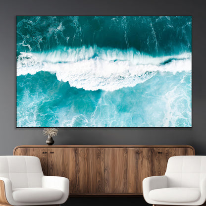 Aerial view of turquoise ocean waves crashing with white foam, perfect for tropical coastal or modern beach-style home decor.