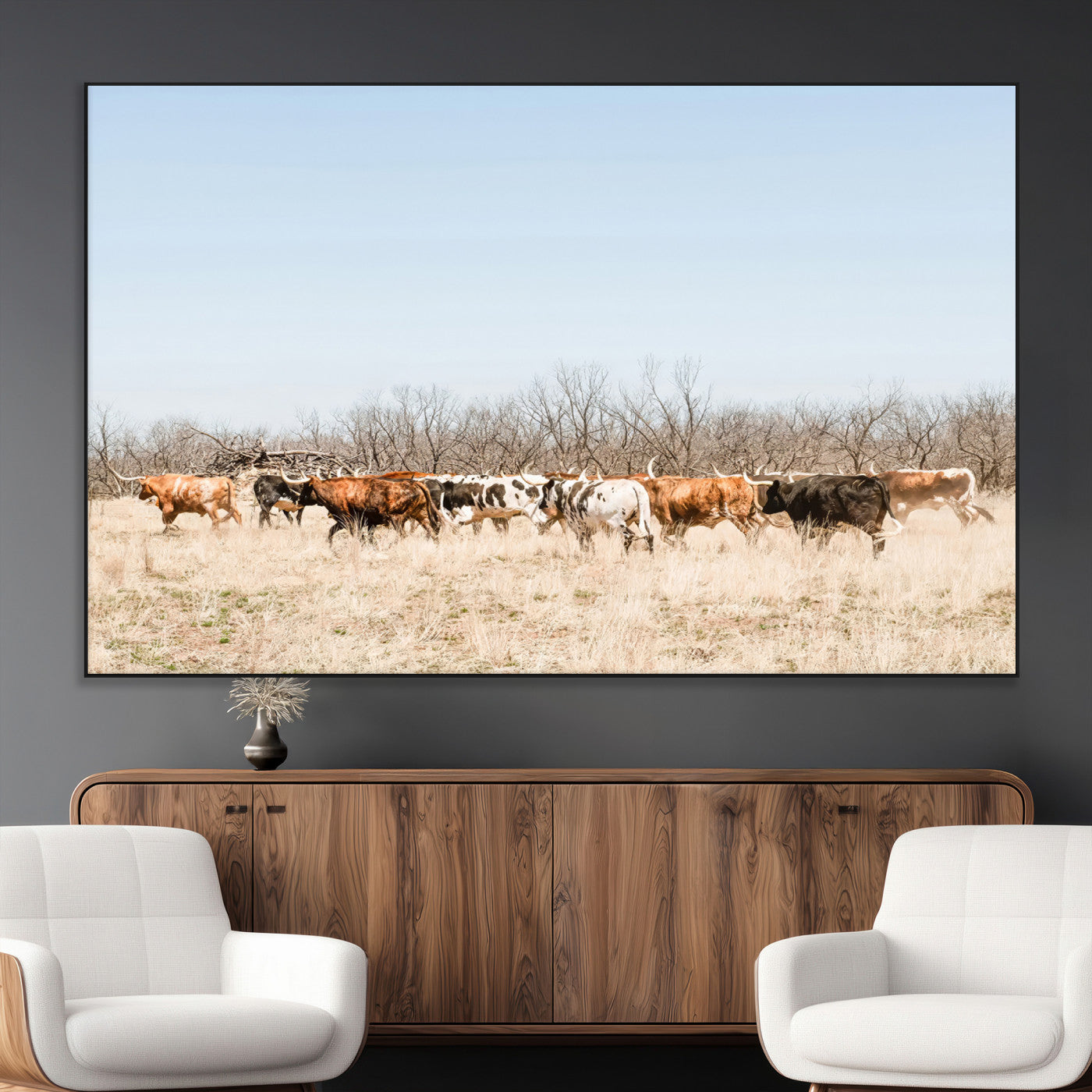 Framed wall art of Texas longhorn cattle walking through a dry, neutral-toned prairie, perfect for rustic farmhouse or western-themed home decor.