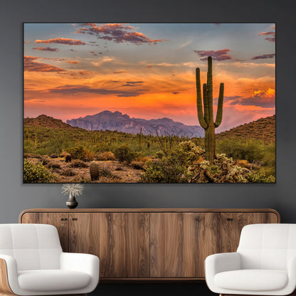 Vibrant desert sunset with saguaro cacti and distant mountains, perfect for Southwestern or warm-toned home decor.