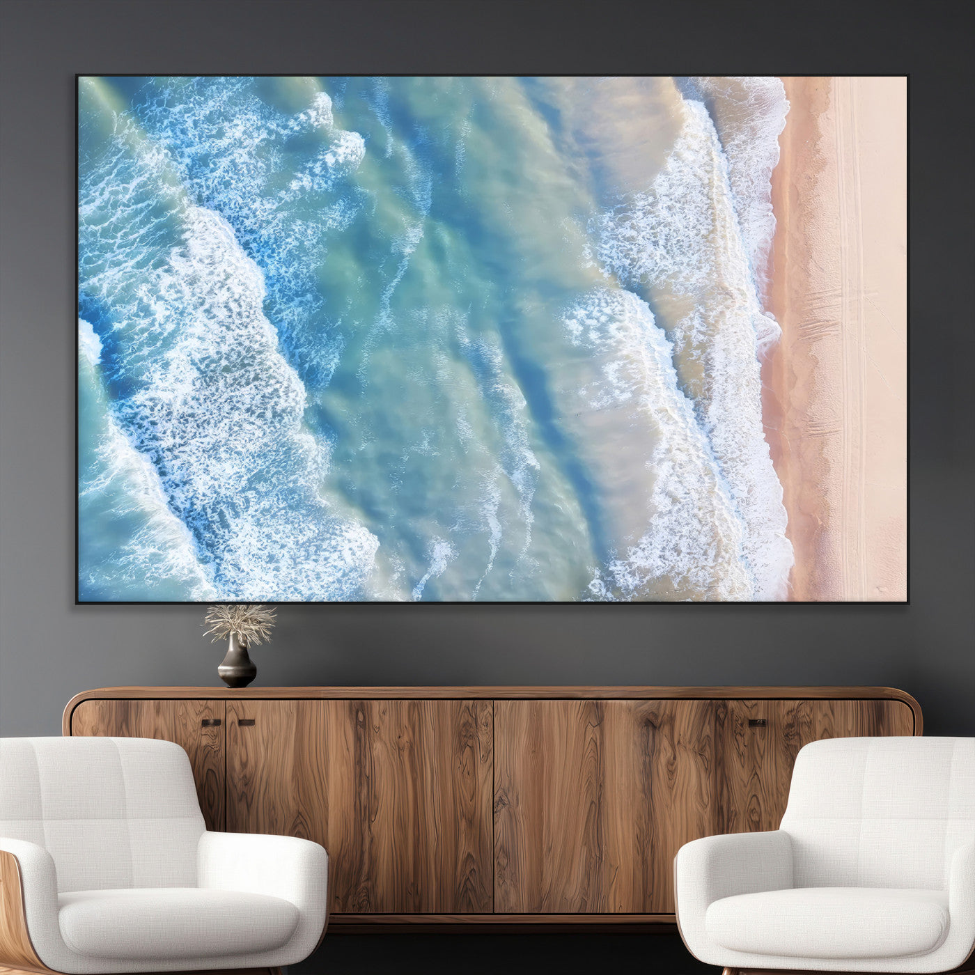 Aerial photo of soft blue waves meeting sandy shore, perfect for modern coastal or beach-themed decor with a light and tranquil aesthetic.