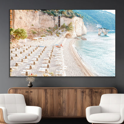 Wall art of a calm Mediterranean beach with rows of sun loungers and umbrellas in soft pastel tones, perfect for light coastal or vacation-themed decor.