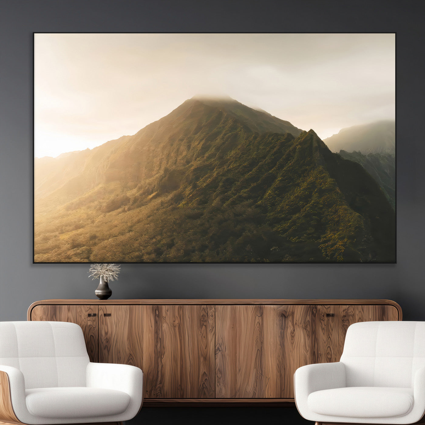 Sunlit mountain peak with mist rolling over its rugged slopes, bathed in golden light, creating a warm and tranquil nature-inspired scene.