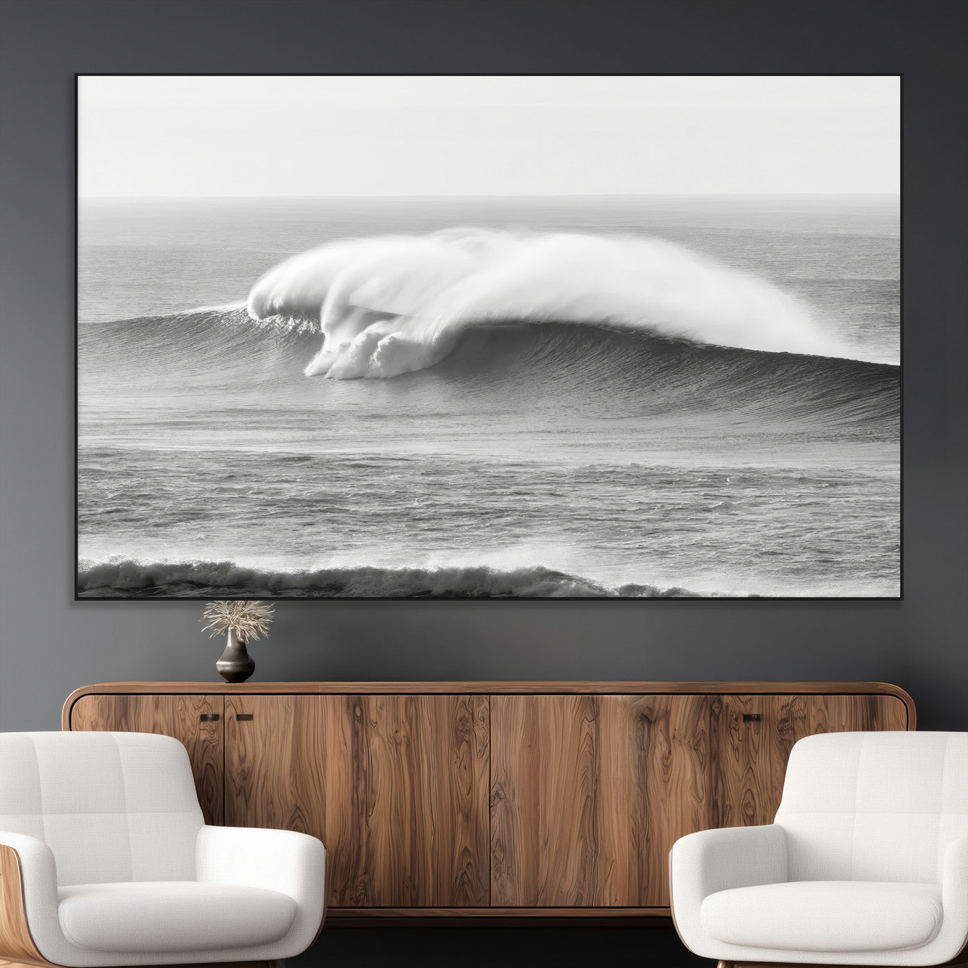 A dramatic black and white ocean wave crashing with immense force, capturing the raw power and movement of the sea in a bold seascape.