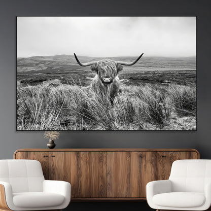 A black and white portrait of a Highland cow in a foggy Scottish countryside, capturing a rustic aesthetic and tranquil farm escape.