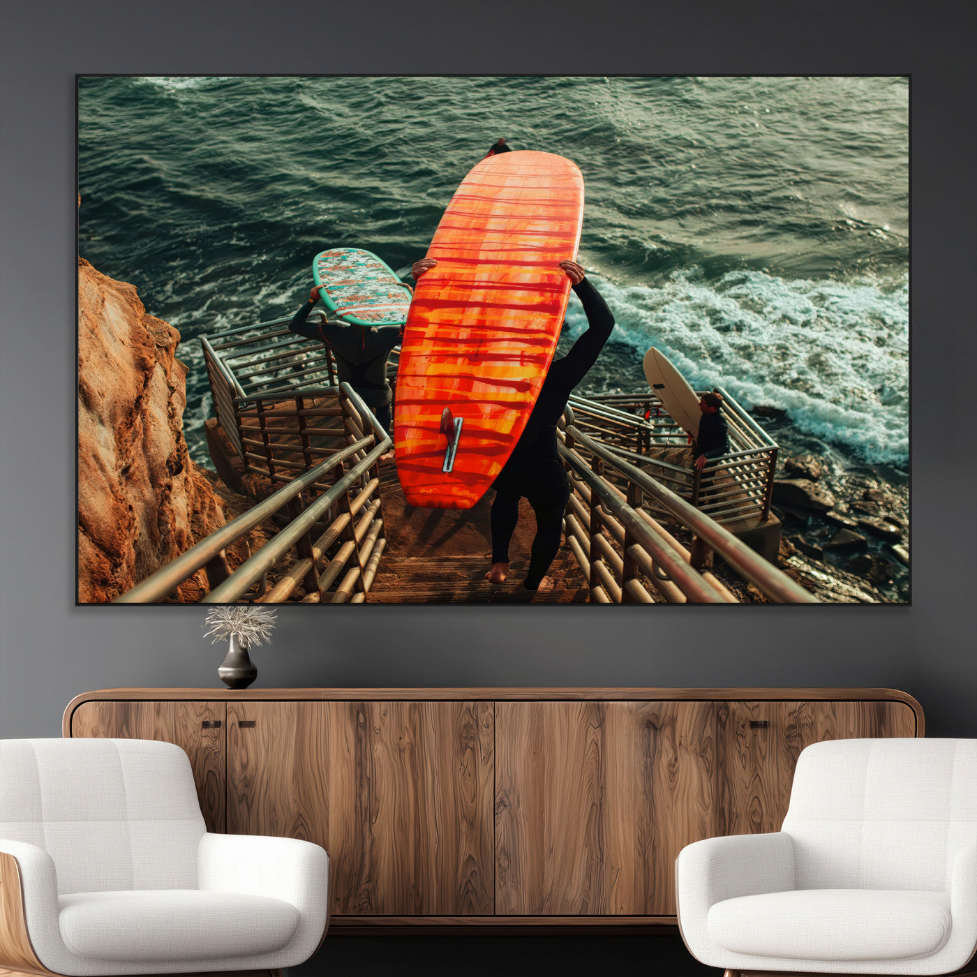 A surfer carrying a bold orange surfboard down a rugged staircase toward the ocean, bathed in golden hour light, capturing the energy of coastal adventure.