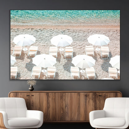A bright beach scene with white umbrellas, pastel sand, and turquoise waters, creating a tranquil coastal vibe, perfect for beach house or summer decor.