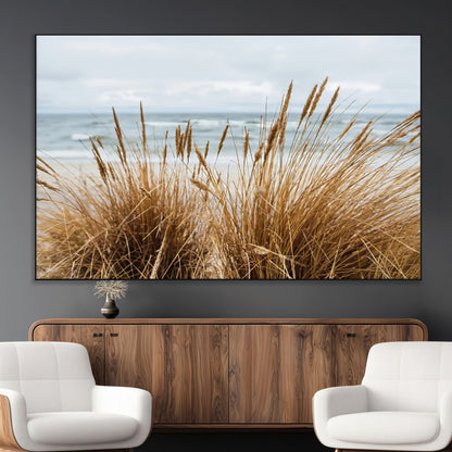 Canvas of golden beach grass swaying by the ocean under a soft cloudy sky, perfect for neutral-toned or coastal minimalist decor.