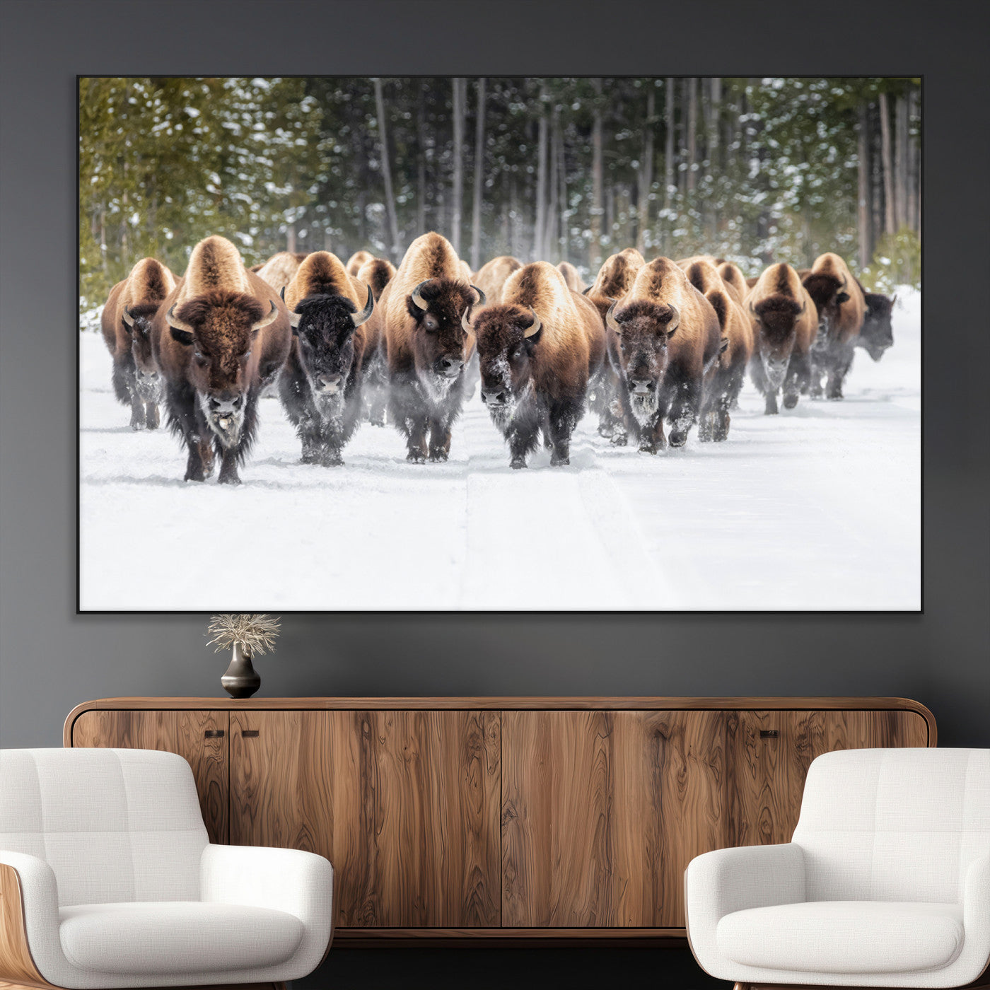 A herd of American bisons walking through a snowy forest path, perfect for rustic cabin or Western-themed wall decor.