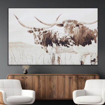 Two longhorn cows standing in a sepia-toned pasture with soft light, ideal for rustic or farmhouse-themed neutral wall decor.