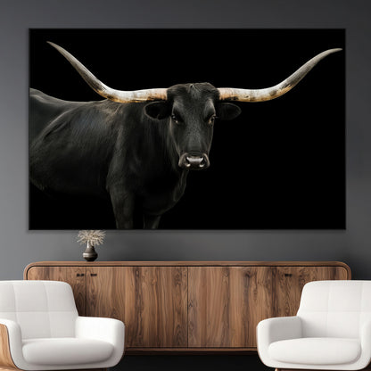 Close-up of a black Texas longhorn with large curved horns on black background, ideal for rustic farmhouse or modern western interiors.