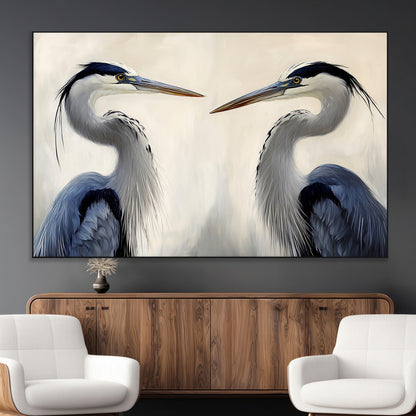 Two blue herons facing each other on a soft neutral background, ideal for coastal, tranquil, or nature-inspired minimalist interiors.