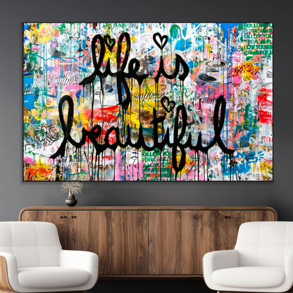 Colorful urban-style canvas with graffiti text “Life is Beautiful” in black paint, ideal for bold or street-themed home decor.