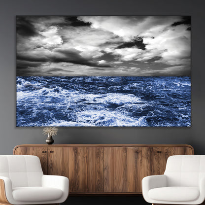 Moody canvas wall art of a stormy ocean under a dramatic black-and-white sky, perfect for bold or coastal-style interiors.