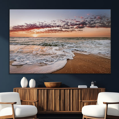 Canvas of a sunset over a foamy ocean shore with warm light and gentle waves, ideal for coastal or beach-themed home decor.