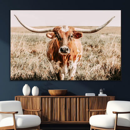 Framed longhorn cow canvas wall art with rustic prairie background, western animal print perfect for farmhouse or ranch style decor