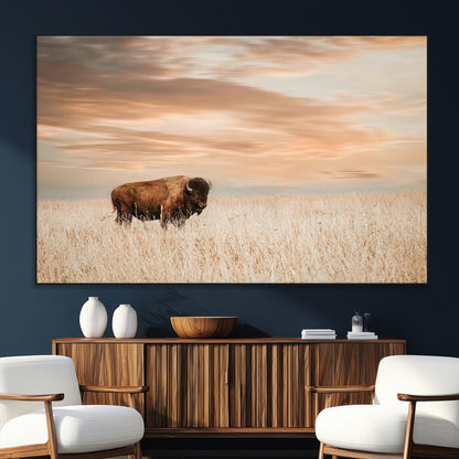 Bison Wall Art Print - Buffalo Canvas Print, featuring a lone bison in a golden prairie under a warm sunset sky, perfect for rustic and farmhouse decor.