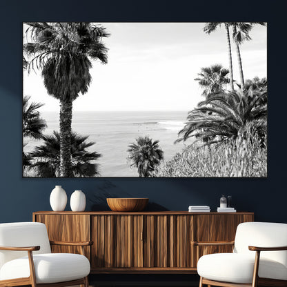 Monochrome canvas of palm trees framing a coastal surf scene, perfect for California-inspired or retro black-and-white beach decor.