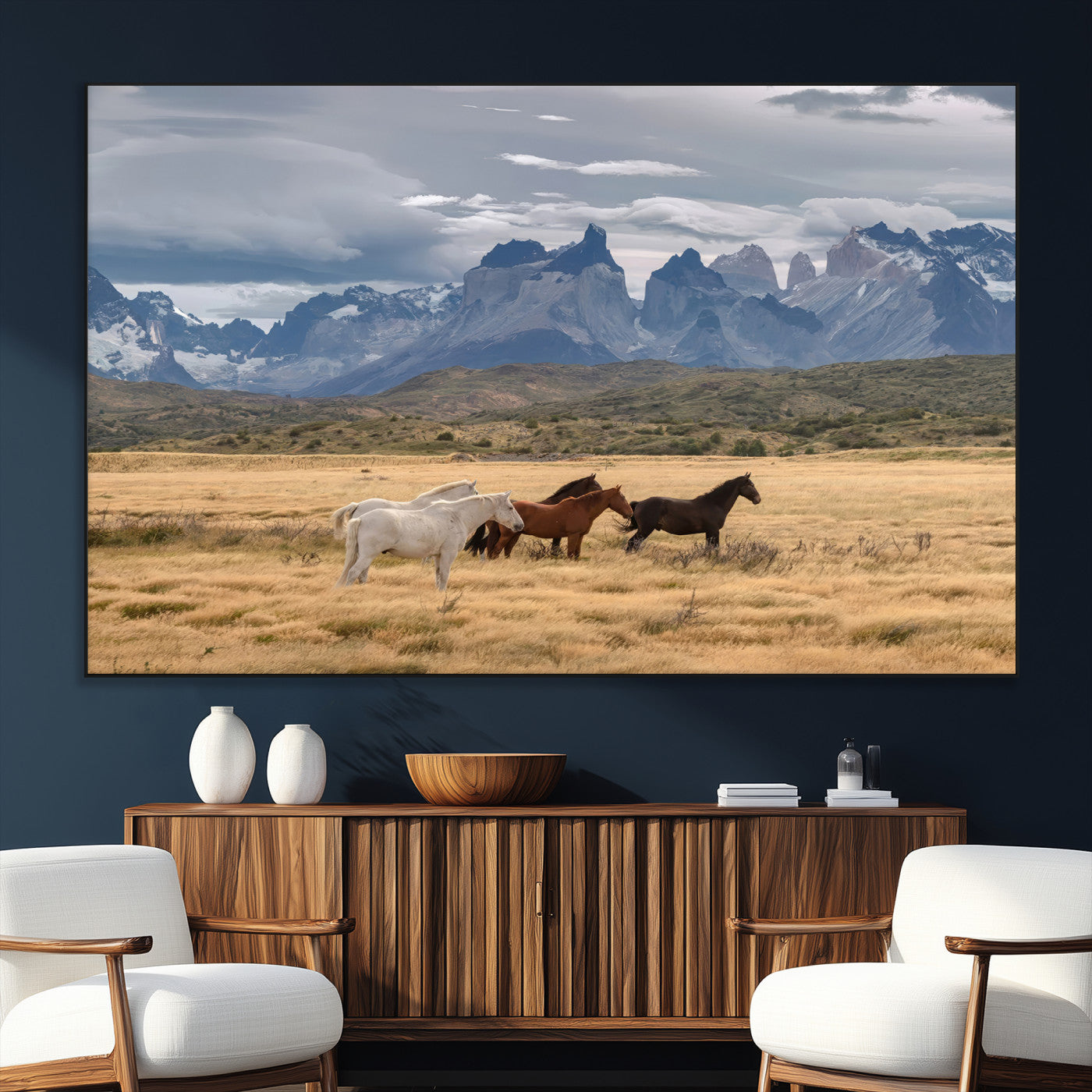 Framed canvas of wild horses grazing in golden Patagonian fields with dramatic mountain backdrop, ideal for rustic or wilderness-inspired decor.