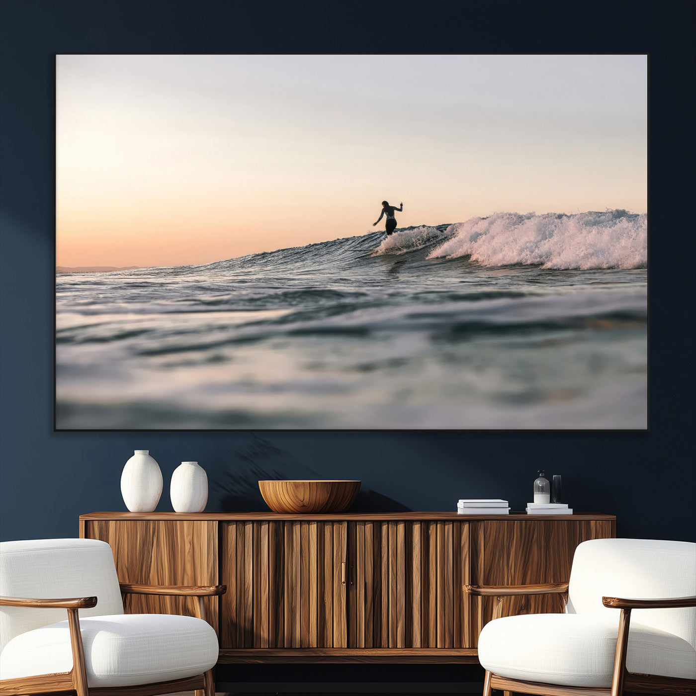 Framed canvas of a female surfer balancing on a wave at sunset, perfect for serene surf or ocean-inspired coastal decor.