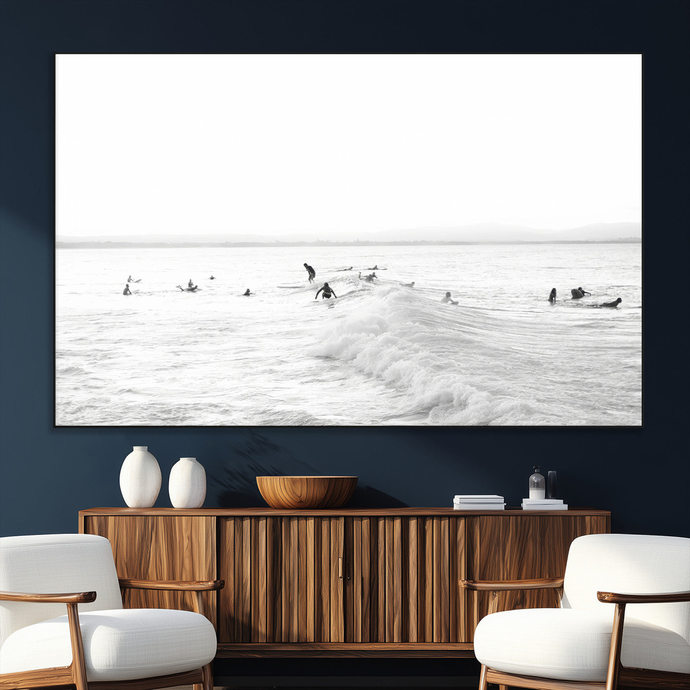 Monochrome photo of surfers riding and waiting on ocean waves, ideal for surf-themed or coastal energy wall decor.