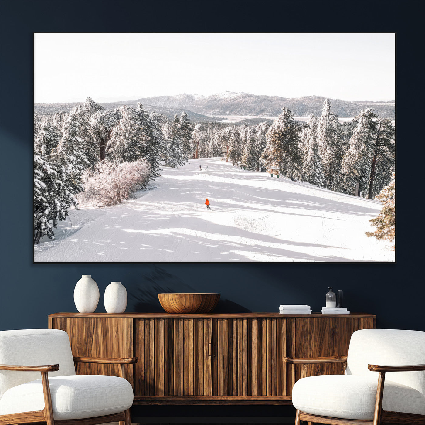 Bright ski trail lined with snow-covered pines and a skier in orange, perfect for alpine adventure or winter sports-inspired decor.