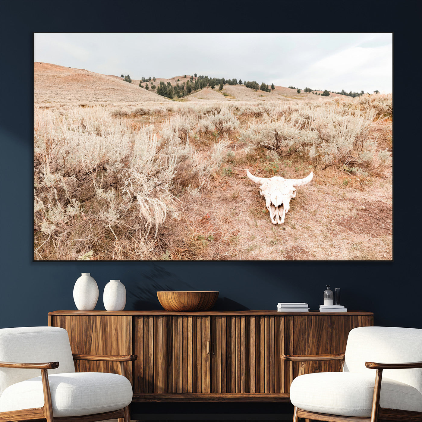 Rustic bull skull on dry sagebrush field under soft light, ideal for western minimal or desert prairie-style wall decoration.