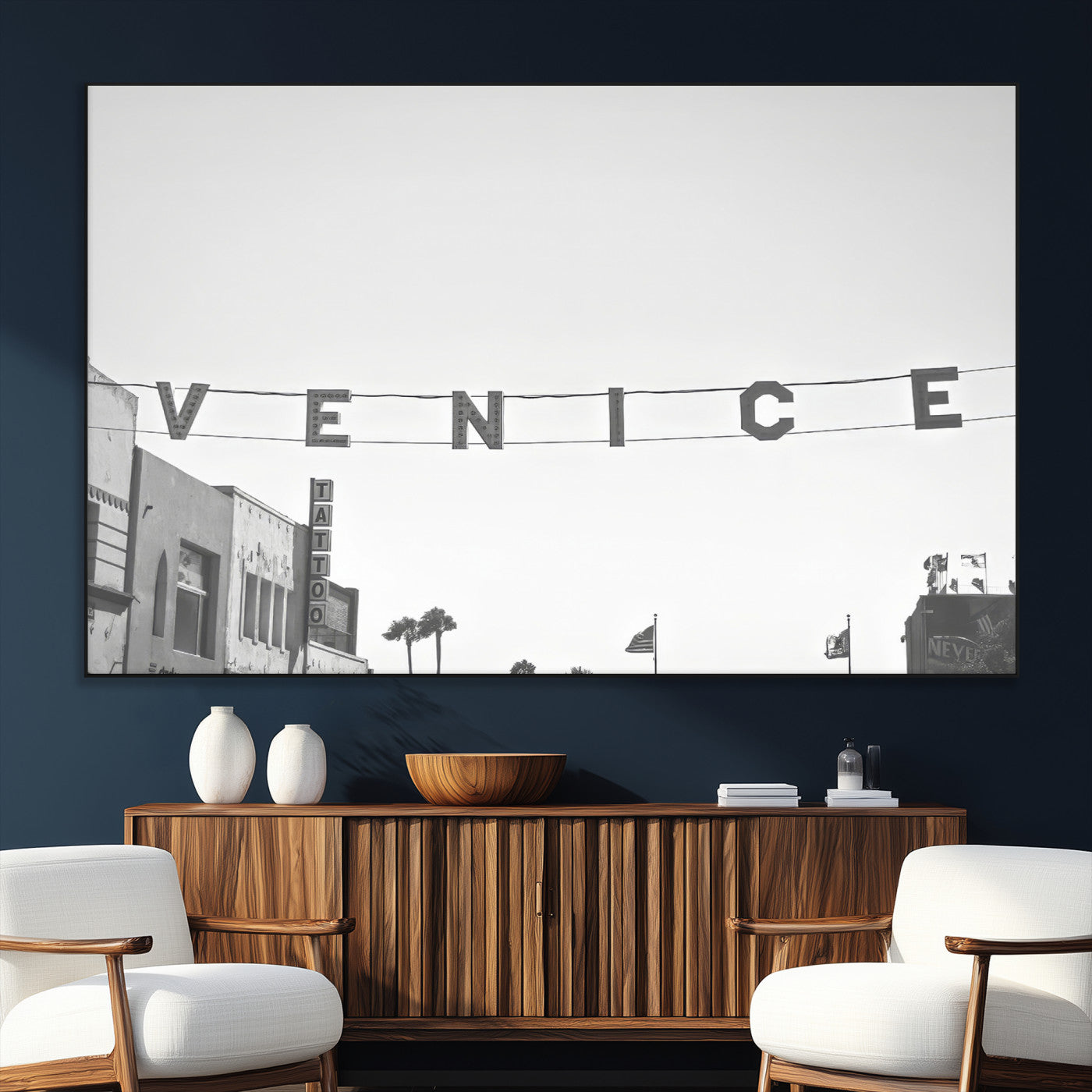 Black and white photo of Venice Beach sign and palm-lined street, perfect for urban coastal or minimalist LA-inspired wall decoration.