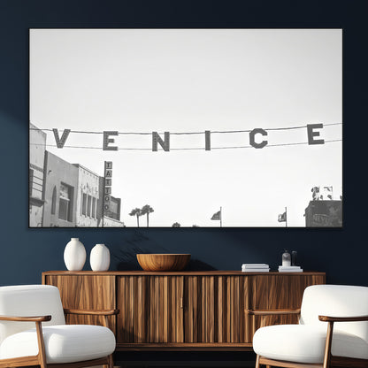 Black and white photo of Venice Beach sign and palm-lined street, perfect for urban coastal or minimalist LA-inspired wall decoration.