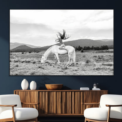 Black and white photo of a woman on a white horse in moody tones, ideal for Western Boho or modern rustic-style home decor.