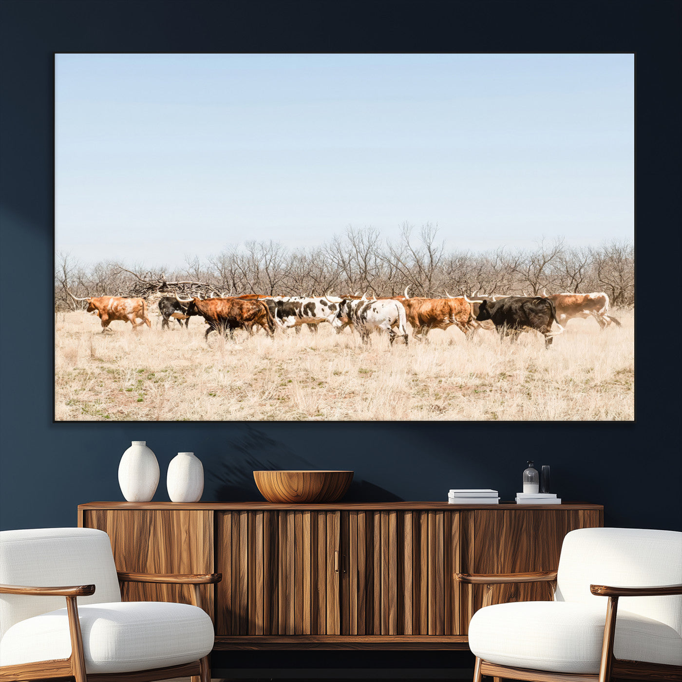 Framed wall art of Texas longhorn cattle walking through a dry, neutral-toned prairie, perfect for rustic farmhouse or western-themed home decor.